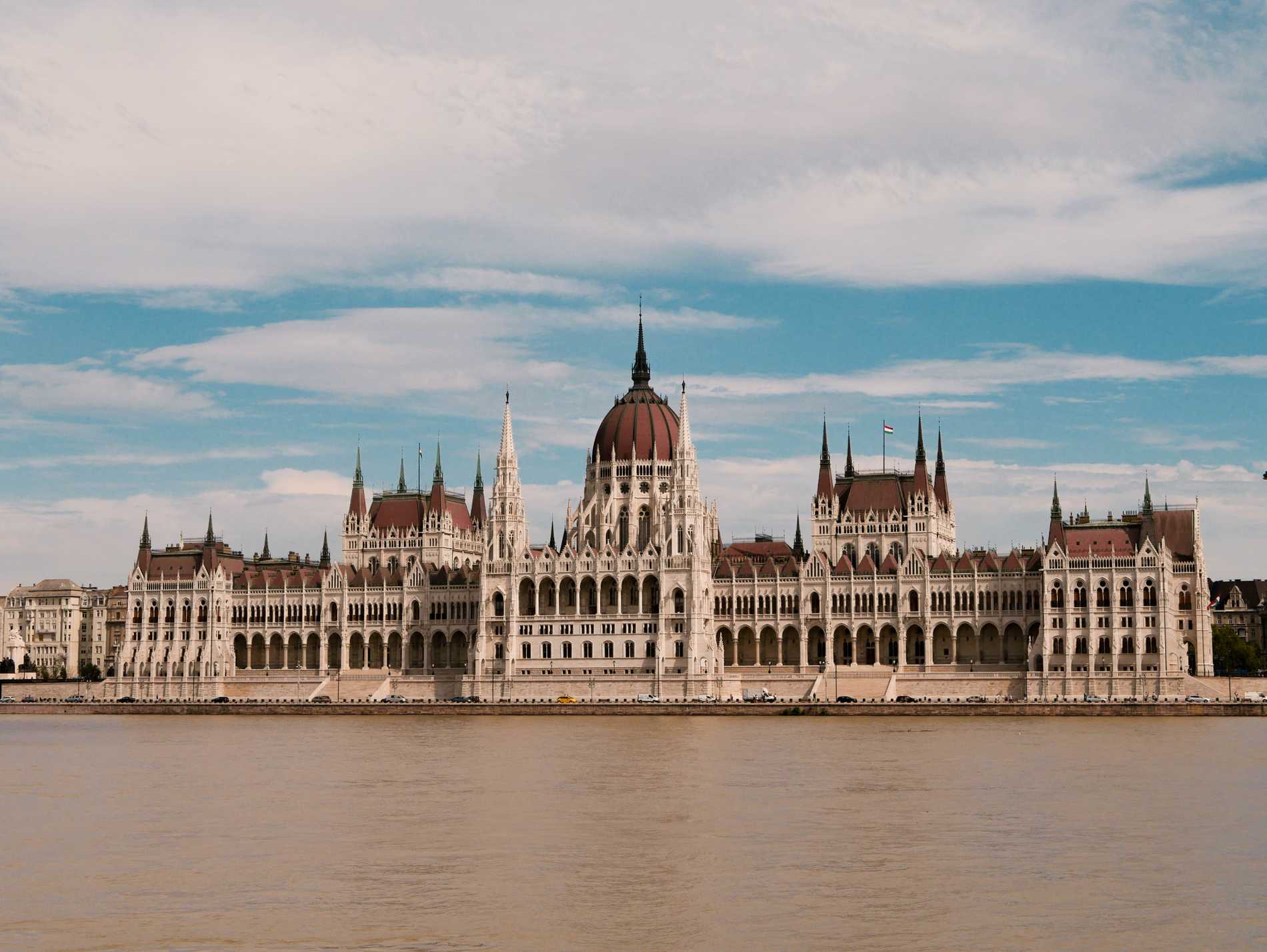 The elaborate neo-gothic Hungarian Parliament Building nestled on the eastern bank of the Danube River.