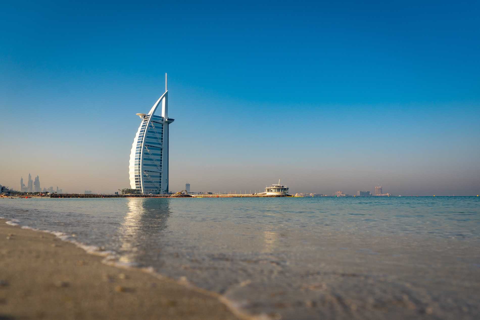 The Burj Al Arab Jumeirah, one of the tallest hotels in the world, looks like a sail rising from the sea.