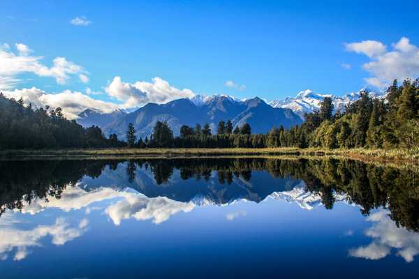 Lake Matheson – South Island, New Zealand: Lake Matheson was formed when the Fox Glacier retreated around 14,000 years ago and was an important food gathering site (mahinga kai) for Maori travelling along the coast. Today it’s popular amongst tourists who come to see the picture-perfect reflections of the snow-capped Southern Alps in the lake. From this vantage point, you can see both Aoraki / Mount Cook and Mount Tasman, New Zealand’s highest peaks.